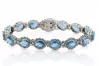 Tennisarmband aus 14 Karat Weißgold mit Aquamarin und Zirkonen tbc001w