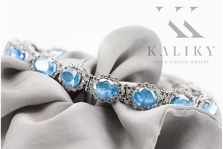 Pulsera de tenis con aguamarina y circonitas en oro blanco de 14k tbc001w