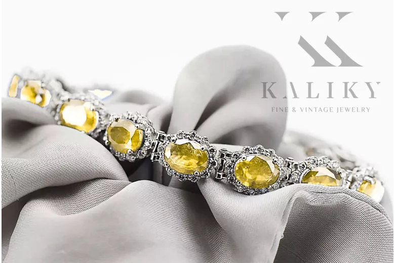 Bransoletka tenisowa z białego złota 14k 585 z peridotem i cyrkoniami tbc001w