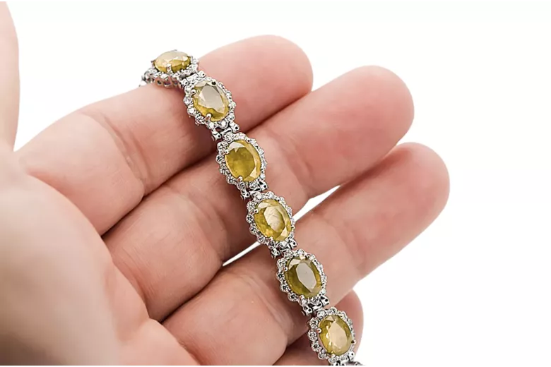 Bransoletka tenisowa z białego złota 14k 585 z peridotem i cyrkoniami tbc001w